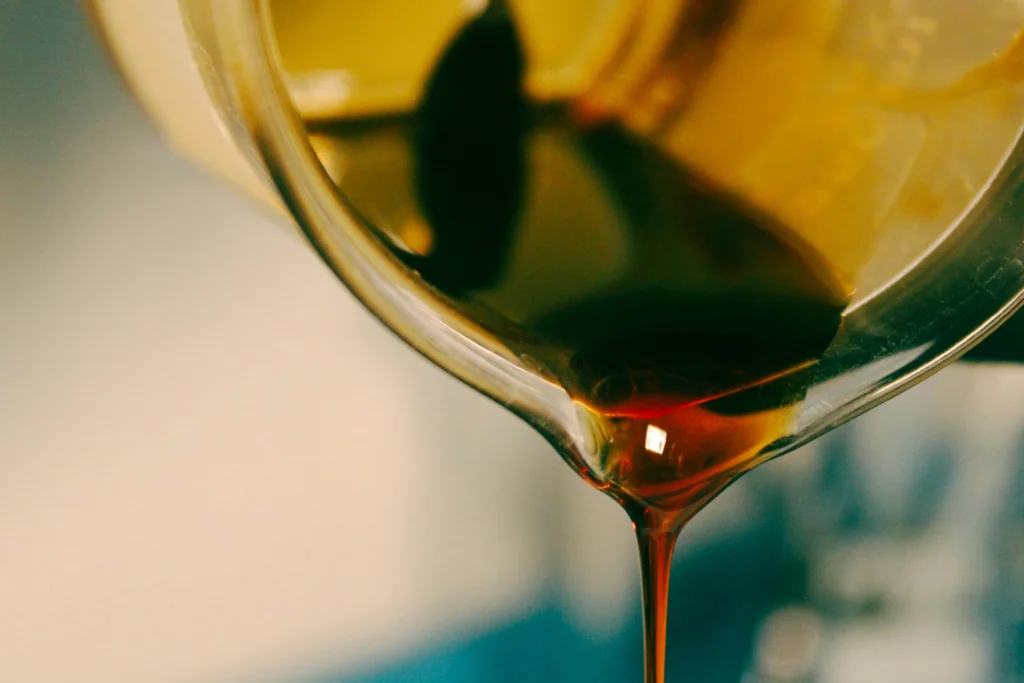Close up of hemp oil being poured